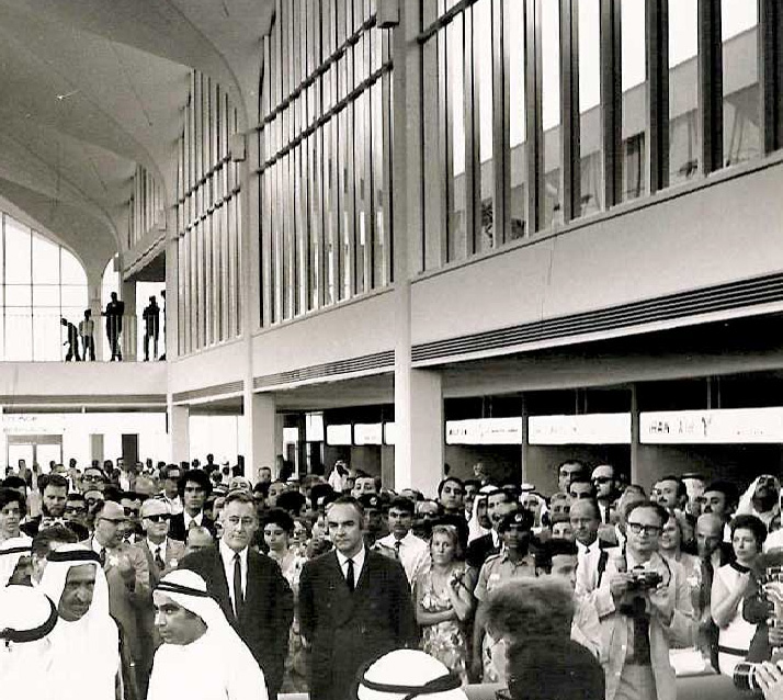 In dark suits and slender ties, Keith Page and Brian Broughton at the opening of Dubai International Airport, May 1971. They formed their partnership, Page & Broughton, to sign the contract for the design of Dubai International Airport. In foreground, left, are Rashid bin Said Al Maktoum, ruler of Dubai, and his adviser Mahdi Al Tajir. Detail, courtesy of Catherine, Fiona, and Jackie Page.